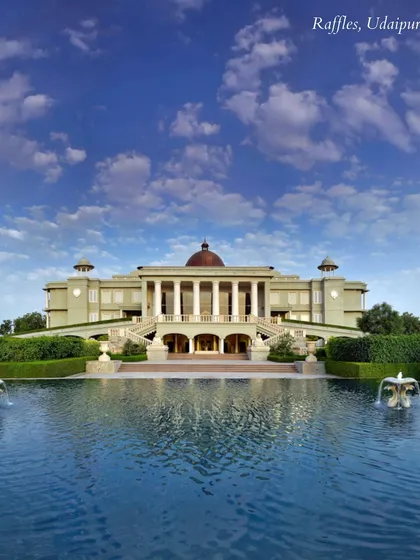 The magnificent facade of Raffles, Udaipur, set against a vast pool. This venue exudes a sense of grandeur and exclusivity, perfect for a high-end luxury wedding.