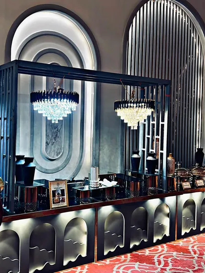 This art deco inspired buffet setup showcases my attention to architectural and design details. The elegant chandeliers and structured framework create a sophisticated serving area for a high-end event.