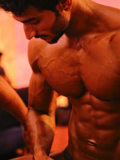 A close-up of my chest and shoulder conditioning. The vascularity and muscle striations are a direct result of a strict diet and intense training.