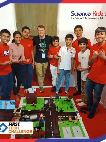 Our team presenting their "Soul City" project at the First Tech Challenge India Championship. This image captures the pride and teamwork involved in competing at a national level, with a guest from an international team showing his support.