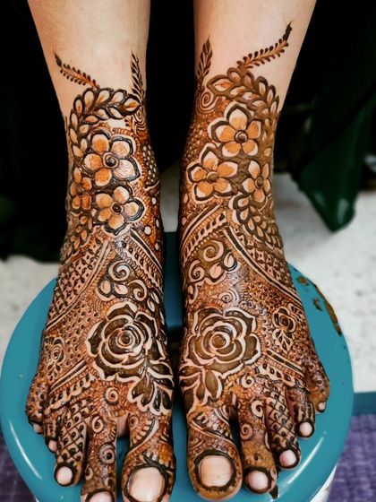 The full bridal mehndi for this lovely bride, including detailed work on her hands and feet.