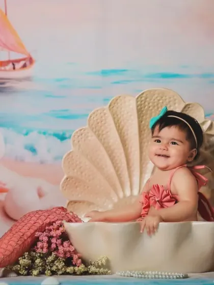 A happy smile from our mermaid. The lighting and setup create a truly enchanting underwater scene.