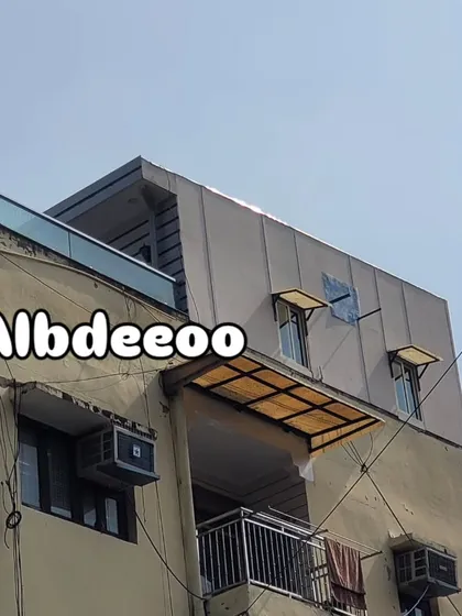 An exterior shot of a completed prefabricated floor on a terrace in Rohini, showing how it sits neatly atop an existing building.