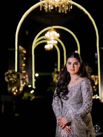 An atmospheric shot of the bride-to-be with her half-up hairstyle.