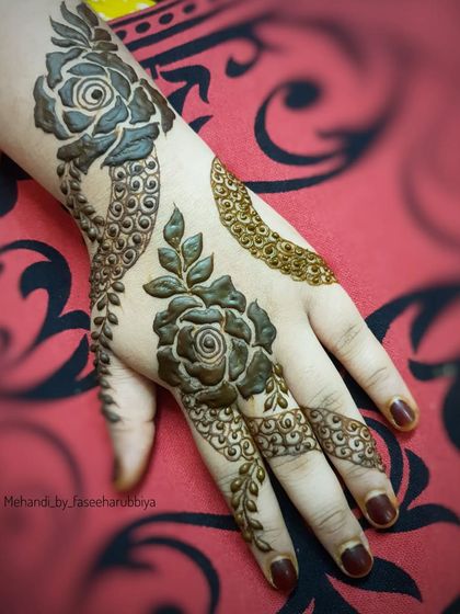 This shot highlights the contrast between the bold, dark roses and the lighter, leafy elements.