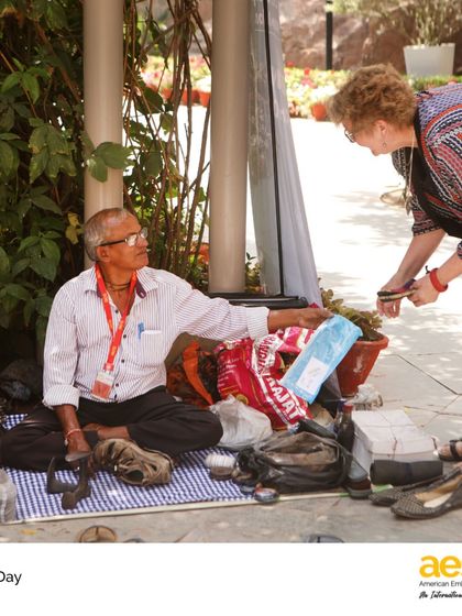 A local cobbler repairs shoes on campus during our Earth Day event. We emphasize the importance of repair over replacement, teaching students practical ways to reduce waste.