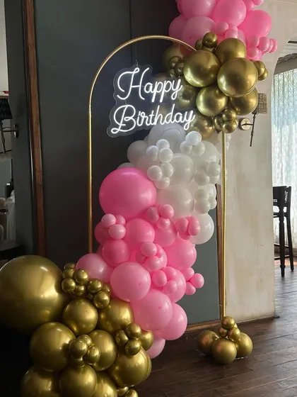 Another angle of the mini balloon backdrop, showing how it can be a perfect, compact photo corner for birthdays and other celebrations.