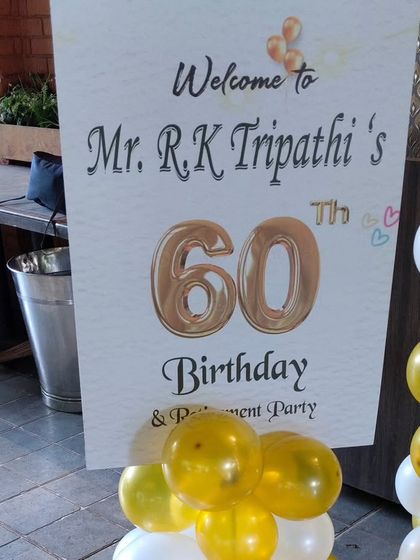 A close-up of the personalized welcome sign for the 60th birthday and retirement party, a small detail that makes guests feel special.
