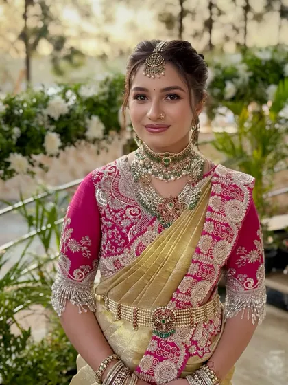 A radiant Muhurtham look for the bride's sister, featuring a stunning Jayanti Reddy saree and layered jewellery.