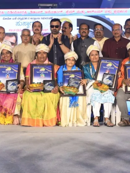 A group photo with fellow award winners and dignitaries at the photography awards ceremony.
