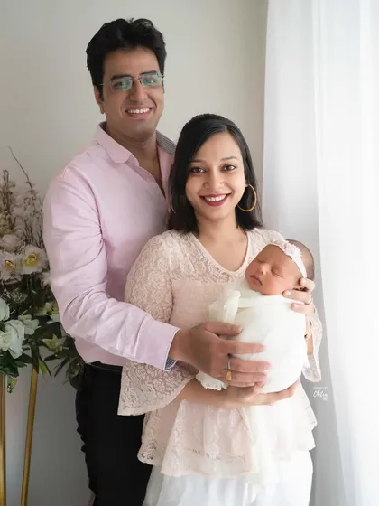 A classic family portrait, with everyone looking towards the camera, celebrating their new arrival. These are the timeless images that will be treasured on walls and in albums for generations.