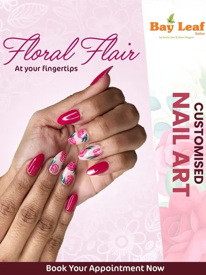 Floral flair at your fingertips. This beautiful custom nail art features glossy magenta nails paired with accent nails showcasing a delicate pink and red rose pattern.