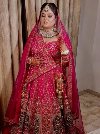 A candid shot showing the beautiful details of the lehenga and the flawless finish of the makeup.