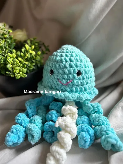 Our crochet jellyfish is designed to be both a toy and a soothing object. The tentacles mimic the feel of an umbilical cord, which can be calming for babies.