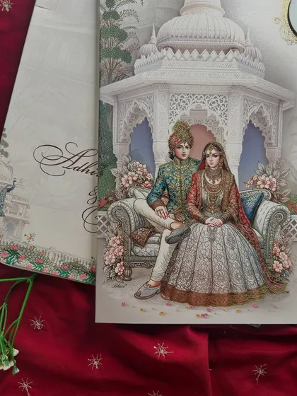 A close-up of the royal couple illustration from the pastel invitation, highlighting the delicate colors and intricate details.