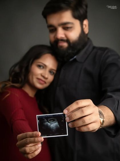 A creative way to share your news. This shot with the sonogram held in the foreground is artistic and full of meaning.