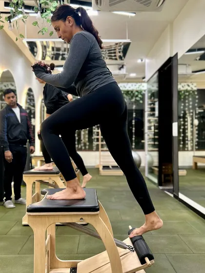 Step-ups on the Pilates chair are amazing for building glute and leg strength while improving your balance.