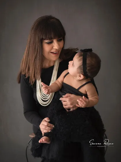A sweet moment between a grandmother and her granddaughter. These classic, elegant portraits are truly timeless treasures.