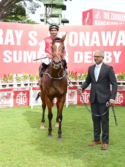 Positano, winner of The Maharaja's Gold Cup (GR II), with jockey Akshay Kumar and trainer S.S. Attaollahi.