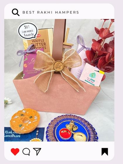 'The Basket Hamper' for Rakhi is a classic choice. This lovely pink basket is filled with waffle butter cookies and other treats, tied with a beautiful pearl-studded bow.