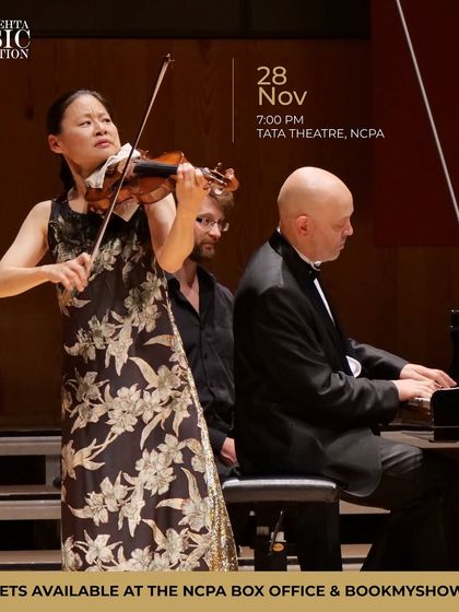 A stunning action shot of Midori and Özgür Aydın performing at the Tata Theatre, NCPA for the Zubin Mehta Celebrity Concert.