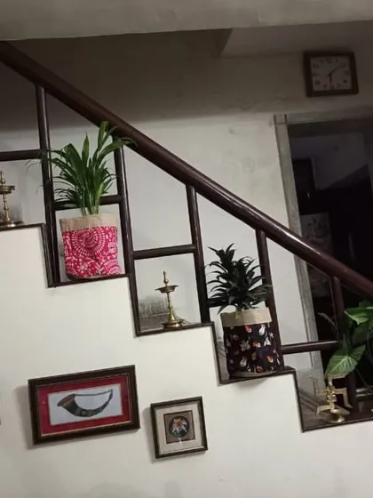 I love using unexpected spaces. Here, I've decorated a staircase with a series of beautiful plants in ethnic printed grow bags, turning a simple passageway into a decorative feature.