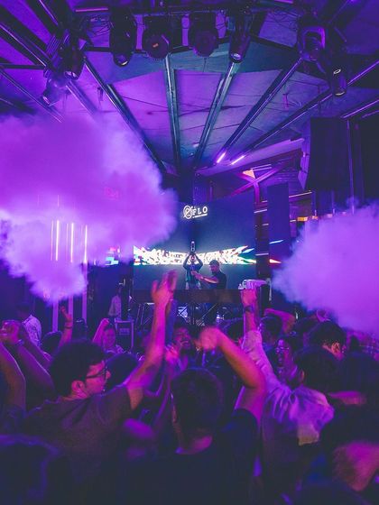 Purple smoke fills the room, creating a mystical and immersive vibe. It's all about engaging every sense.