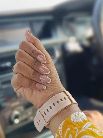 A perfect example of how a classic French manicure looks in the real world. This clean and elegant design on almond-shaped nails is timeless. I use high-quality gel polish to make sure the white tips are crisp and the nude base is flawless.