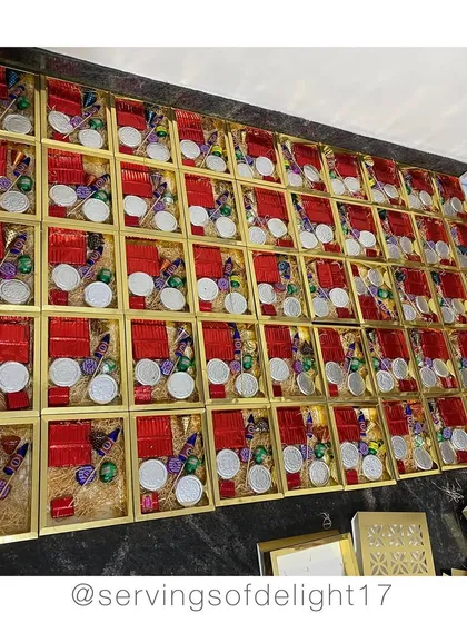 Packing up boxes of my famous edible firecracker chocolates for Diwali. They look just like the real thing but are so much tastier!
