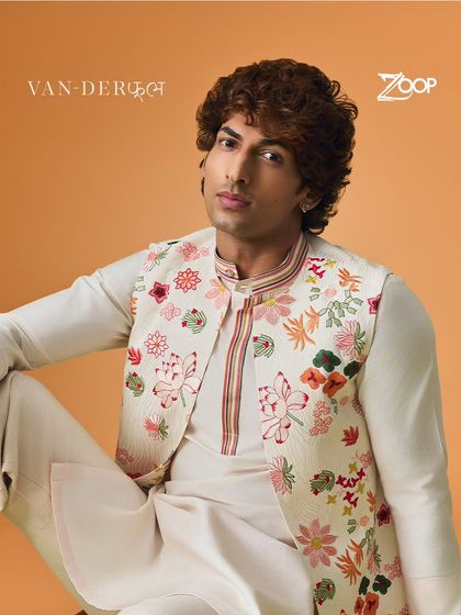 Dive into the beauty of intricate design with this Vanderphool piece. The floral embroidered Nehru jacket is a work of art, perfect for elevating a simple kurta.