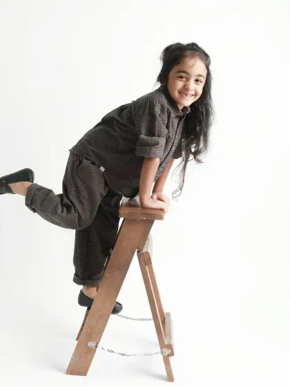 A playful pose on a small ladder. This shot from a pre-mundan session is full of energy and character.