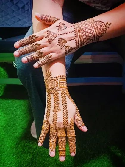 A creative shot of the minimalist mehandi, perfect for showing off at a party.