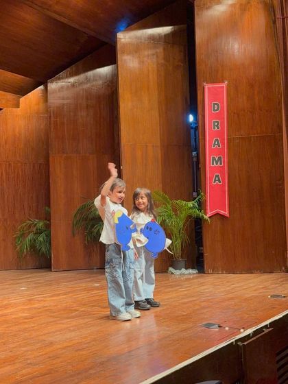 Two performers use creative props to represent emotions, a great exercise in abstract expression.