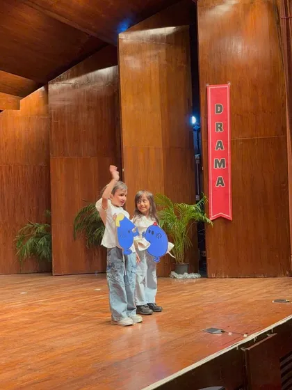 Two performers use creative props to represent emotions, a great exercise in abstract expression.