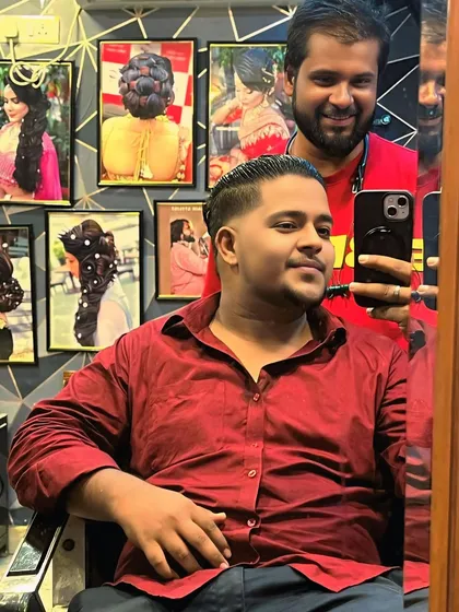 A mirror selfie with a happy client after his haircut. It's always great to see clients feeling confident with their new style.