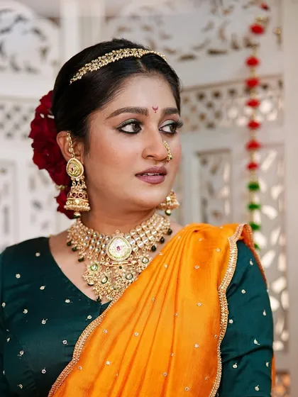 A beautiful fusion look that combines traditional elements with modern elegance. The defined eye makeup and glowing skin create a captivating and artistic style.