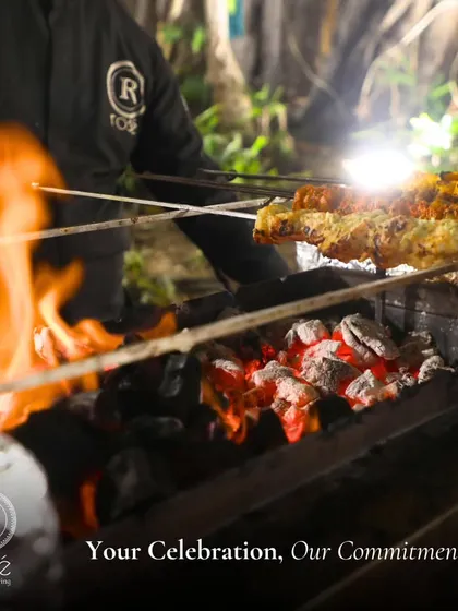 Your celebration is our commitment. A chef grills skewers of paneer and chicken tikka over open flames, showcasing the dedication and skill that goes into our live cooking.