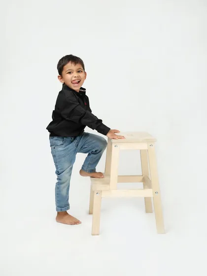 A happy little boy, full of smiles and energy. Simple, clean studio portraits like this are perfect for capturing a child's personality at any age.