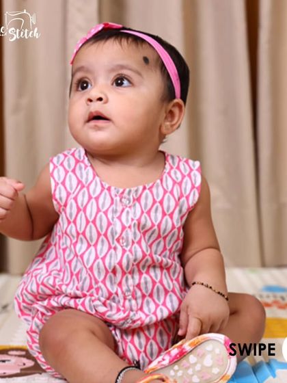 A swipe-through post showing different angles of a baby enjoying our pink printed romper. It's designed for real life and real babies.