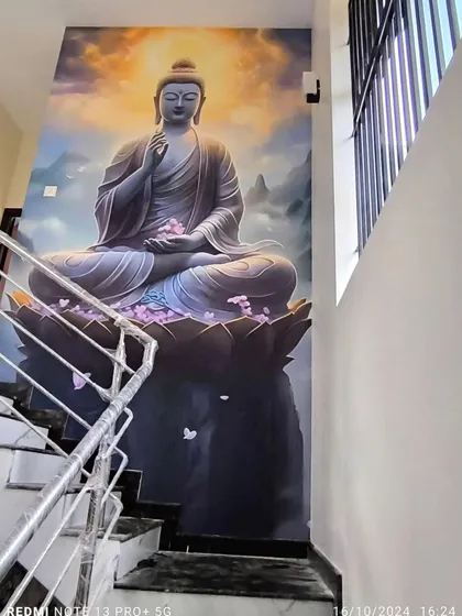 A double-height staircase wall is the perfect canvas for a large-scale mural. This serene Buddha artwork creates a tranquil and impressive feature, turning a simple stairway into a peaceful journey.