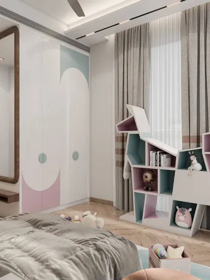 In this girl's bedroom, we incorporated playful storage solutions like this custom elephant-shaped bookshelf. The wardrobe features pastel-colored geometric patterns, and a full-length mirror with a seating nook adds a functional and stylish touch to the space.