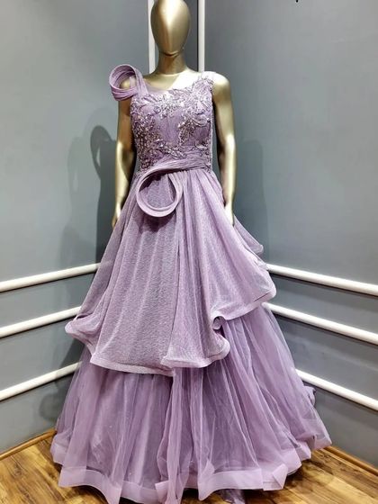 A mannequin view of our lavender gown with structured ruffles and an embellished bodice. This shows the unique design and craftsmanship of this modern party dress.
