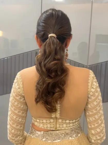 A back view of the simple ponytail, showing the beautiful, soft waves.
