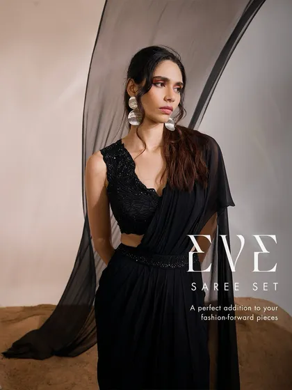A closer look at the Eve Saree Set, a perfect addition to your collection of fashion-forward pieces with its textured blouse and flowing ruffle drape.