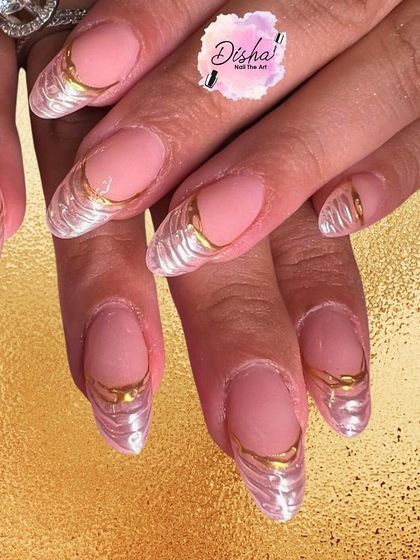 The kind of gold we love. This design features a sheer pink base with textured, pearlescent tips outlined in a beautiful liquid gold effect.