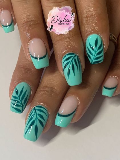 Bringing a touch of nature to this manicure. I created a mix of solid mint green nails and accent nails with hand-painted tropical leaves for a fresh, summery vibe.