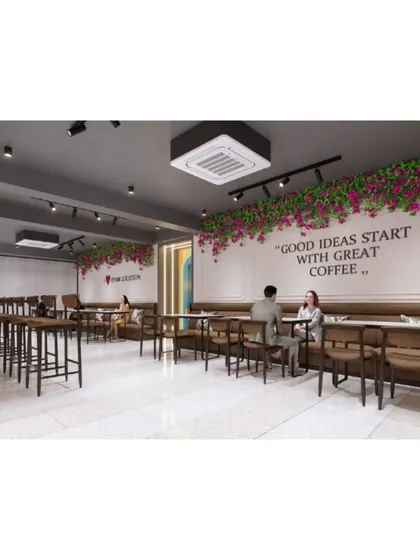 Another view of the main dining area, showing the floral installations and wall quotes that add personality to the space.