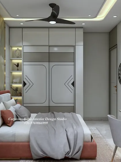 This angle shows the full-wall wardrobe with its sleek, modern design, which complements the luxurious feel of the headboard wall.