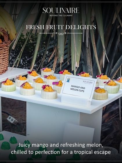 Fresh fruit delights featuring mango and melon cups. A juicy and refreshing dessert, chilled to perfection for a tropical escape.