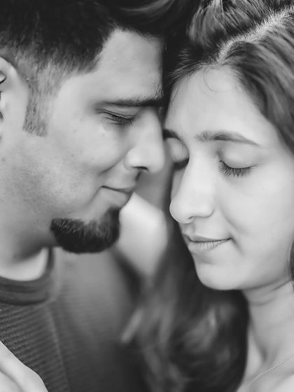 An intimate close-up of Anjali and Platini. Removing color allows the viewer to focus on their expressions and the quiet connection in this moment.